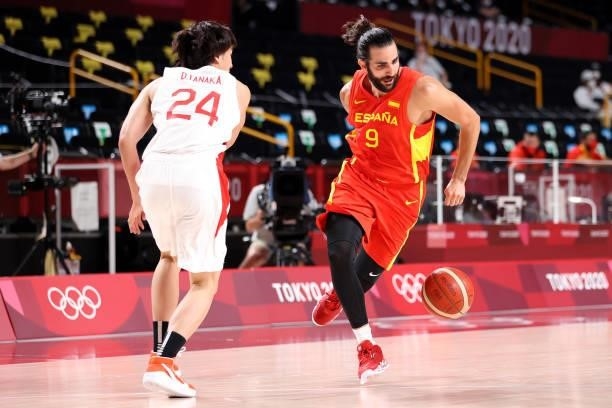 Ricky Rubio of Team Spain dribbles behind his back as he drives past Daiki Tanaka of Team Japan during the second half of the Men's Preliminary Round...