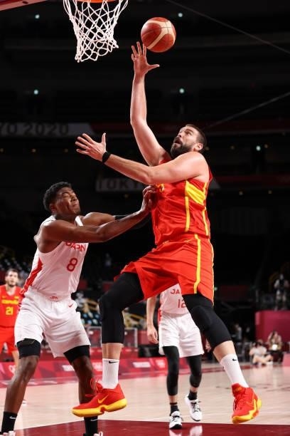 Marc Gasol of Team Spain shoots a layup over Rui Hachimura of Team Japan during the second half of the Men's Preliminary Round Group C game on day...
