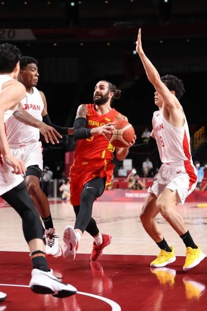 Ricky Rubio of Team Spain drives to the basket and splits defenders Yudai Baba Rui Hachimura of Team Japan during the second half of the Men's...