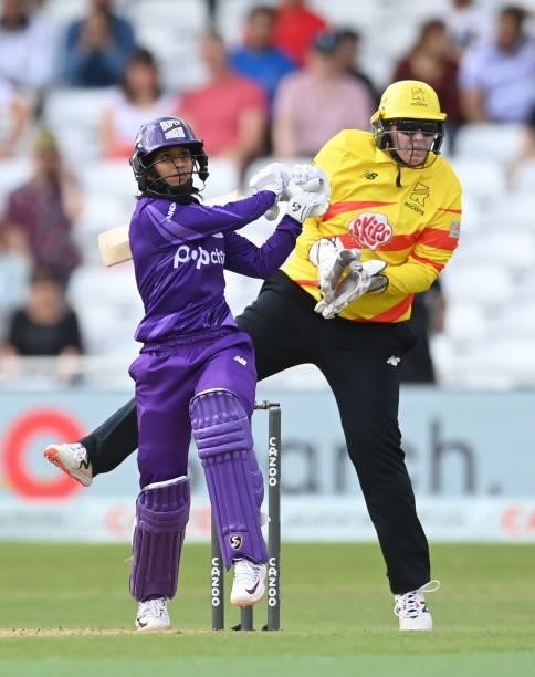 Jemimah Rodrigues of Northern Superchargers hits out watched by Rachel Priest of Trent Rockets during The Hundred match between Trent Rockets and...