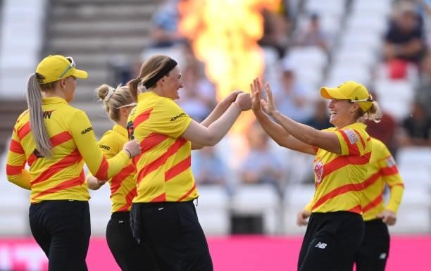 Rockets bowler Sammy-Jo Johnson celebrates the wicket of Rodrigues with Katherine Brunt who took the catch during the Hundred match between Trent...