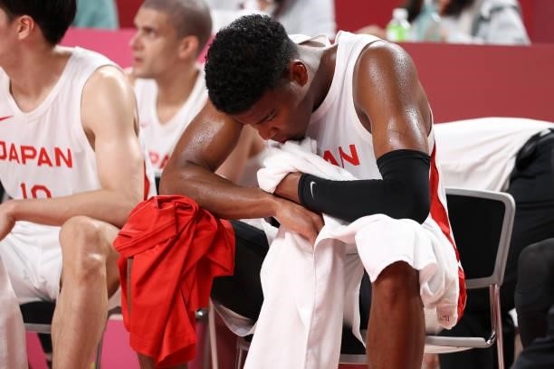 Rui Hachimura of Team Japan reacts in disappointment as he sits on the bench during the second half of the Men's Preliminary Round Group C game...