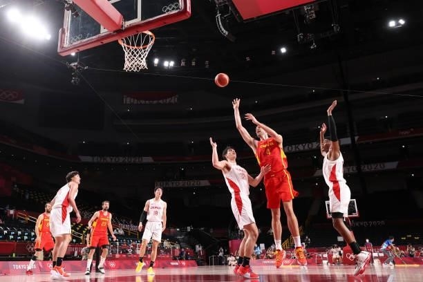 Pau Gasol of Team Spain shoots over Avi Koki Schafer and Rui Hachimura of Team Japan during the second half of the Men's Preliminary Round Group C...