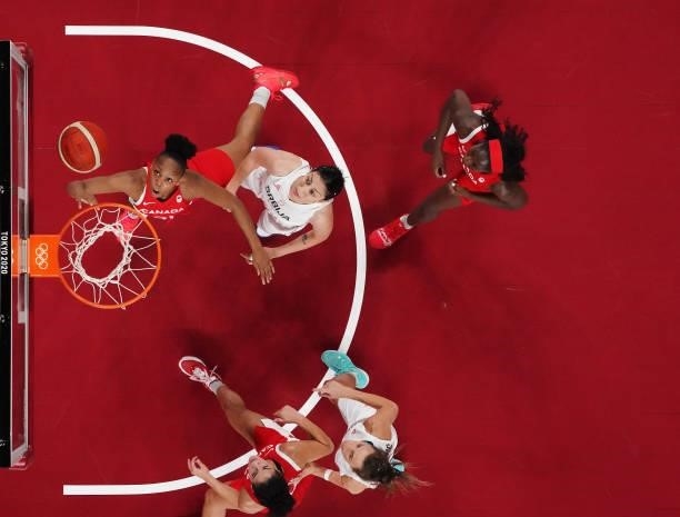 Nirra Fields of Team Canada drives past Jelena Brooks of Team Serbia for a layup during the first half of the Men's Preliminary Round Group C game on...