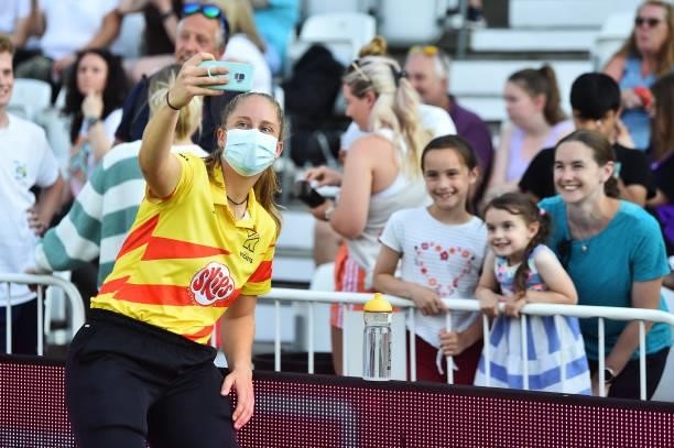 Abigail Freeborn of Trent Rockets takes a selfie with fans during The Hundred match between Trent Rockets and Northern Superchargers at Trent Bridge...