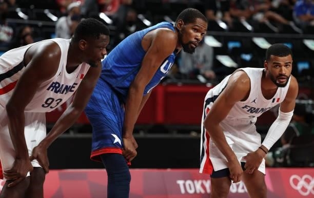 Kevin Durant of USA between Moustapha Fall and Timothe Luwawu-Cabarrot of France during the Men's Preliminary Round Group B basketball game between...