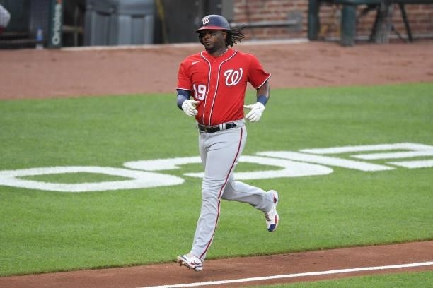 Josh Bell of the Washington Nationals rounds the bases after hitting a home run during a baseball game against the Baltimore Orioles at Oriole Park...