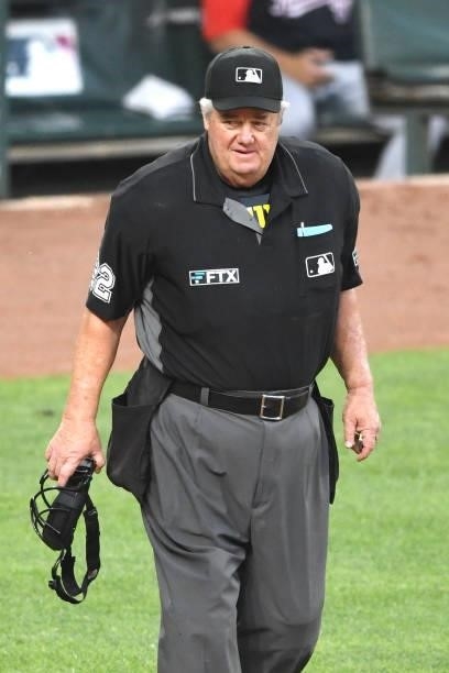 Umpire Joe West looks on during a baseball game between the Baltimore Orioles and the Washington Nationals at Oriole Park at Camden Yards on July 23,...