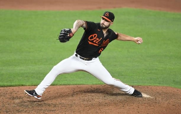 Tanner Scott of the Baltimore Orioles pitches during a baseball game against the Washington Nationals at Oriole Park at Camden Yards on July 23, 2021...