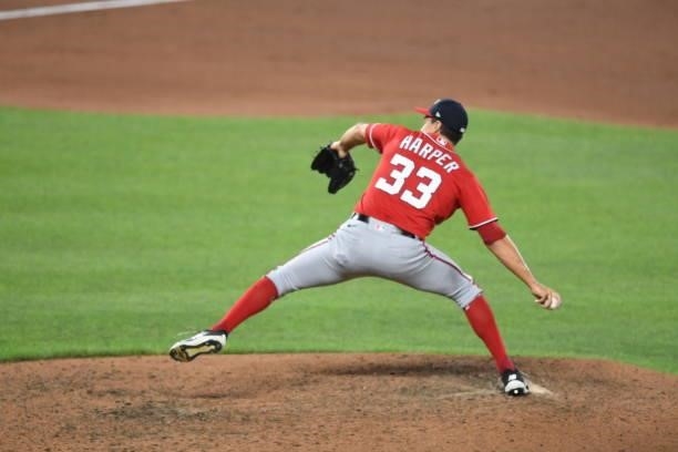 Ryne Harper of the Washington Nationals pitches during a baseball game against the Baltimore Orioles at Oriole Park at Camden Yards on July 23, 2021...