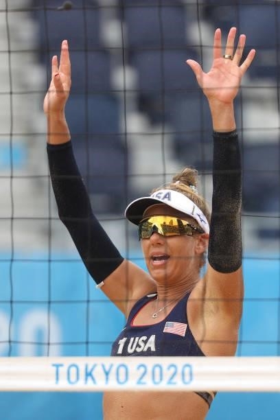 April Ross of Team United States celebrates after defeating Team Spain during the Women's Preliminary - Pool B beach volleyball on day four of the...