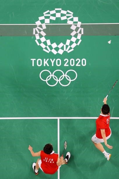 Li Jun Hui and Liu Yu Chen of Team China compete against Takeshi Kamura and Keigo Sonoda of Team Japan during a Men's Doubles Group C match on day...