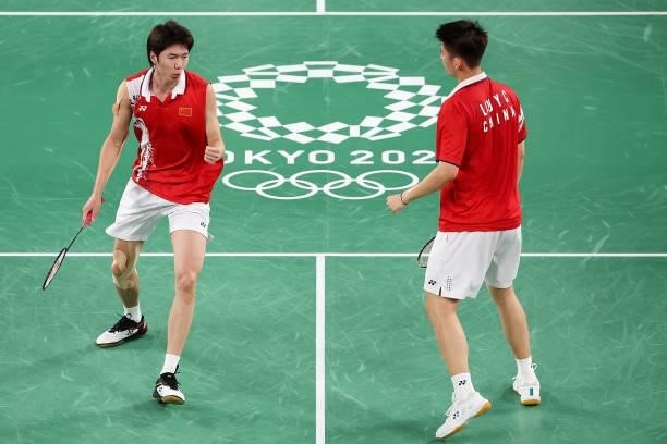Li Jun Hui and Liu Yu Chen of Team China react as they compete against Takeshi Kamura and Keigo Sonoda of Team Japan during a Men's Doubles Group C...