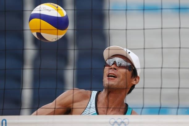 Katsuhiro Shiratori of Team Japan tracks the ball against Team Italy during the Men's Preliminary - Pool F beach volleyball on day four of the Tokyo...
