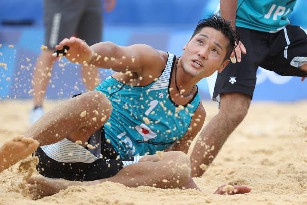 Yusuke Ishijima of Team Japan looks on against Team Italy during the Men's Preliminary - Pool F beach volleyball on day four of the Tokyo 2020...