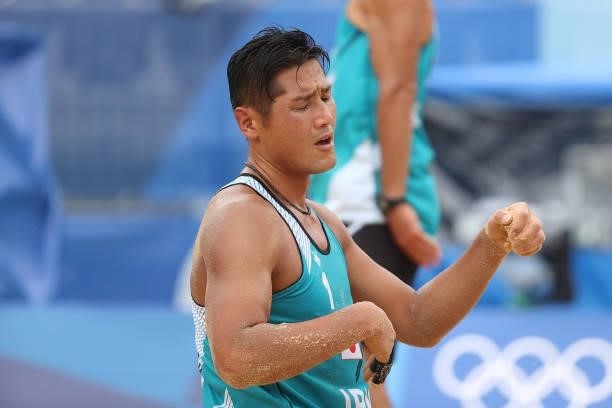 Yusuke Ishijima of Team Japan reacts against Team Italy during the Men's Preliminary - Pool F beach volleyball on day four of the Tokyo 2020 Olympic...