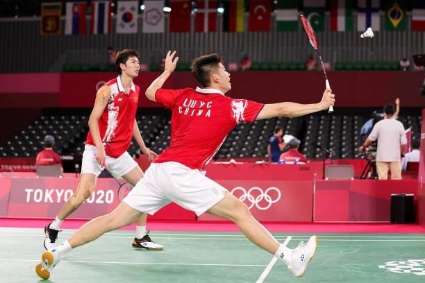 Li Jun Hui and Liu Yu Chen of Team China compete against Takeshi Kamura and Keigo Sonoda of Team Japan during a Men's Doubles Group C match on day...