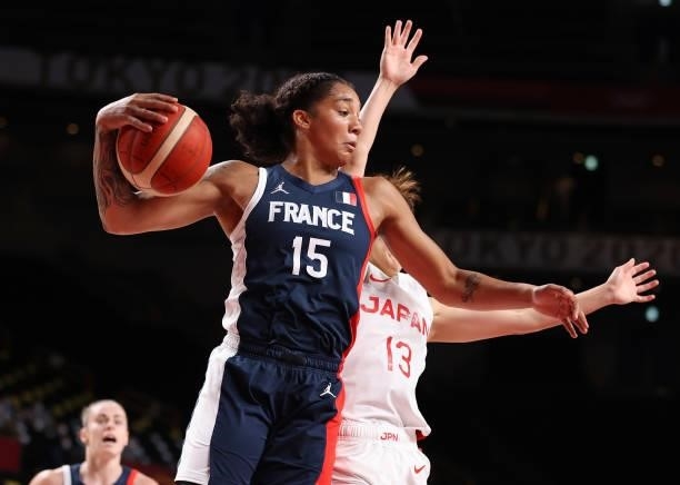 Gabrielle Williams of Team France grabs a rebound against Rui Machida of Team Japan during the first half of a Women's Preliminary Round Group B game...