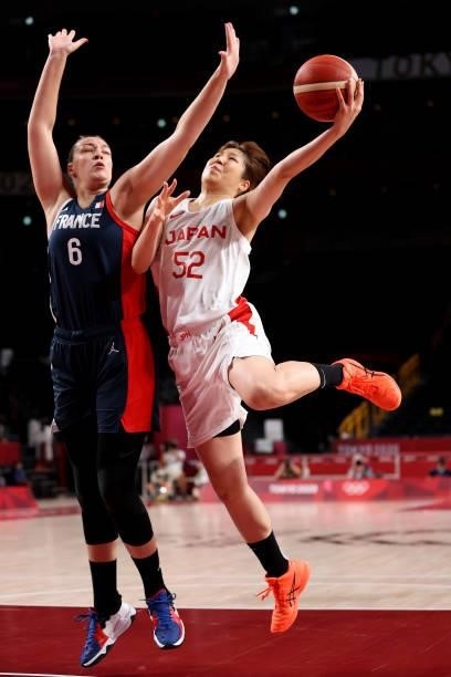 Yuki Miyazawa of Team Japan goes up for a shot against Alexia Chartereau of Team France during the first half of a Women's Preliminary Round Group B...