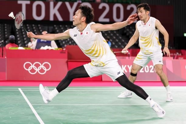 Takeshi Kamura and Keigo Sonoda of Team Japan compete against Li Jun Hui and Liu Yu Chen of Team China during a Men's Doubles Group C match on day...
