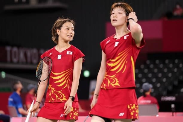 Yuki Fukushima and Sayaka Hirota of Team Japan react as they compete against Greysia Polii and Apriyani Rahayu of Team Indonesia during a Women's...