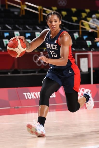 Gabrielle Williams of Team France brings the ball up court against Japan during a Women's Preliminary Round Group B game on day four of the Tokyo...