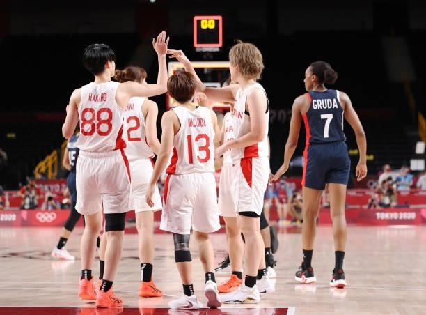Members of Japan celebrate a win against France during a Women's Preliminary Round Group B game on day four of the Tokyo 2020 Olympic Games at...