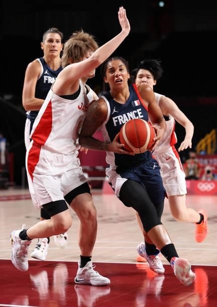 Gabrielle Williams of Team France is pressured by Maki Takada of Team Japan during a Women's Preliminary Round Group B game on day four of the Tokyo...