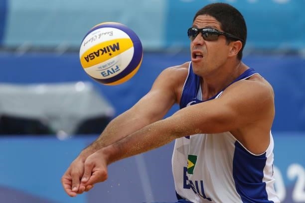 Alvaro Morais Filho of Team Brazil returns the ball against Team United States during the Men's Preliminary - Pool D beach volleyball on day four of...