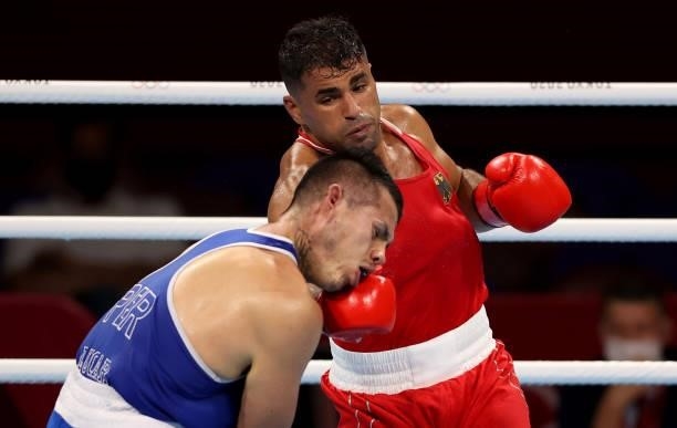 Ammar Riad Abduljabbar of Germany exchanges punches with Jose Maria Lucar Jaimes of Peru during the Men's Heavy on day four of the Tokyo 2020 Olympic...