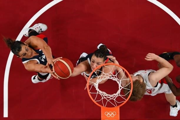 Helena Ciak and Alexia Chartereau of Team France grab a rebound against Maki Takada of Team Japan during a Women's Preliminary Round Group B game on...
