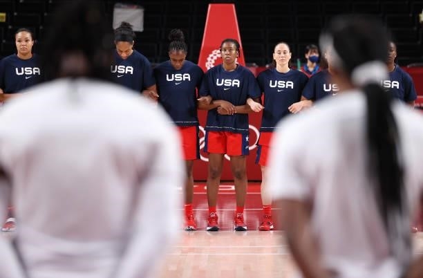 Members of United States of America lock arms before a game against Nigeria during a Women's Preliminary Round Group B game on day four of the Tokyo...