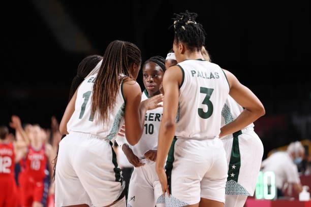 Promise Amukamara of Team Nigeria huddles with here team against United States of America during a Women's Preliminary Round Group B game on day four...