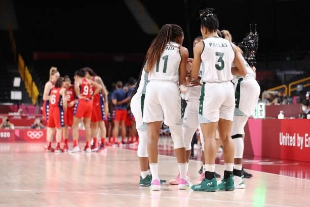 Members of Team Nigeria huddle against United States of America during a Women's Preliminary Round Group B game on day four of the Tokyo 2020 Olympic...