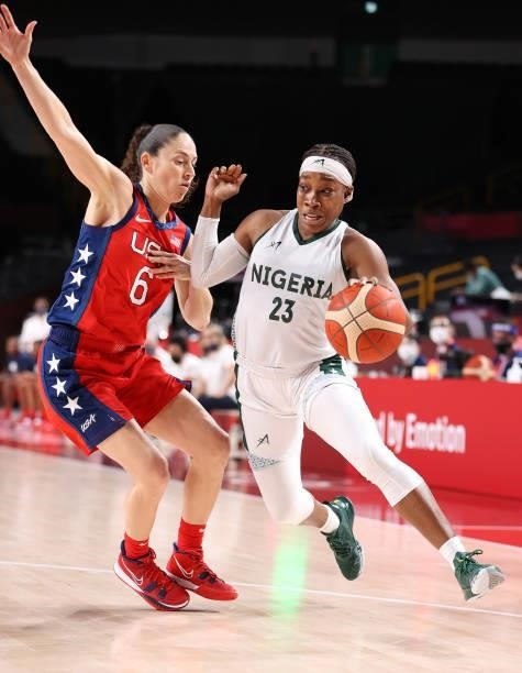 Ezinne Kalu of Team Nigeria drives to the basket against Sue Bird of Team United States during a Women's Preliminary Round Group B game on day four...