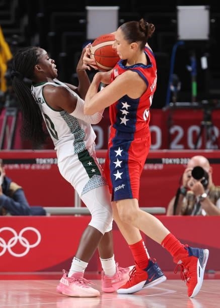 Promise Amukamara of Team Nigeria and Diana Taurasi of Team United States tangle for possession during a Women's Preliminary Round Group B game on...