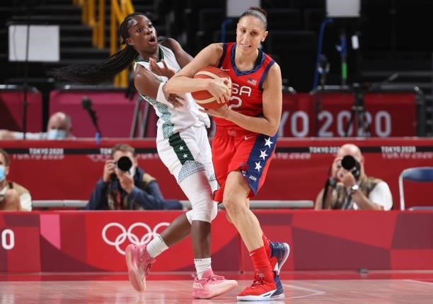 Promise Amukamara of Team Nigeria and Diana Taurasi of Team United States tangle for possession during a Women's Preliminary Round Group B game on...