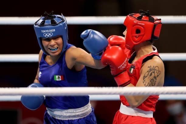 Rebecca Nicoli of Italy exchanges punches with Esmeralda Falcon Reyes of Mexico during the Women's Light on day four of the Tokyo 2020 Olympic Games...
