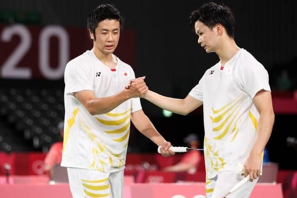 Hiroyuki Endo and Yuta Watanabe of Team Japan react as they win against Kim Astrup and Anders Skaarup Rasmussen of Team Denmark during a Men's...