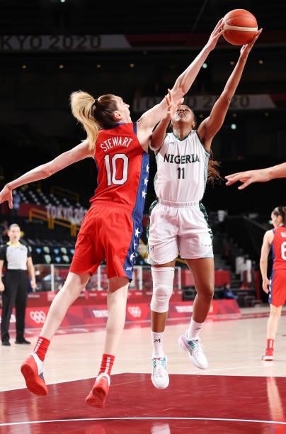Adaora Elonu of Team Nigeria is defended by Breanna Stewart of Team United States during a Women's Preliminary Round Group B game on day four of the...