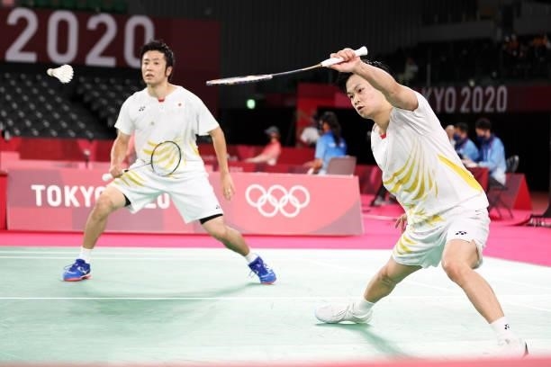 Hiroyuki Endo and Yuta Watanabe of Team Japan compete against Kim Astrup and Anders Skaarup Rasmussen of Team Denmark during a Men's Doubles Group B...