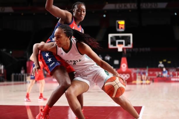 Oderah Chidom of Team Nigeria drives to the basket against Tina Charles of Team United States during a Women's Preliminary Round Group B game on day...
