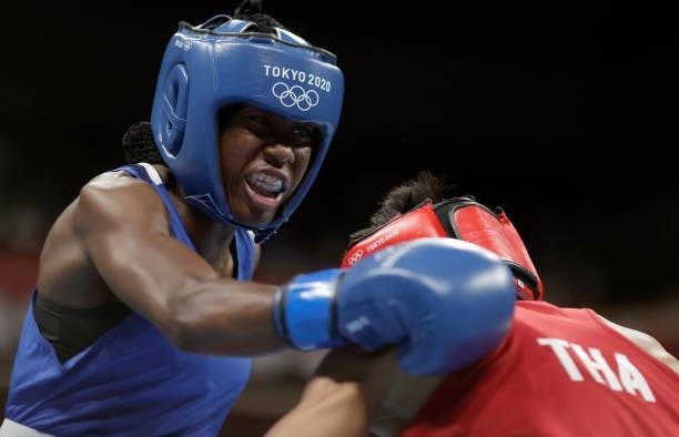 Sudaporn Seesondee of Thailand exchanges punches with Maria Jose Palacios Espinoza of Ecuador during the Women's Light on day four of the Tokyo 2020...