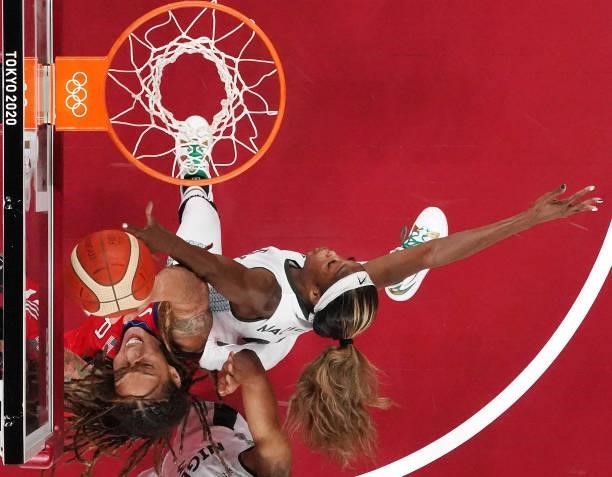 Victoria Macaulay of Team Nigeria defends Brittney Griner of Team United States during a Women's Preliminary Round Group B game on day four of the...