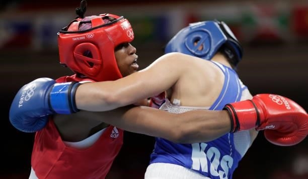 Caroline Dubois of Great Britain exchanges punches with Donjeta Sadiku of Kosovo during the Women's Light on day four of the Tokyo 2020 Olympic Games...