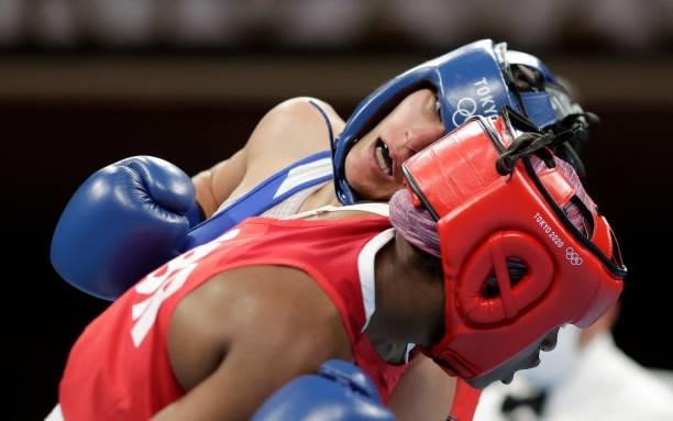 Caroline Dubois of Great Britain exchanges punches with Donjeta Sadiku of Kosovo during the Women's Light on day four of the Tokyo 2020 Olympic Games...