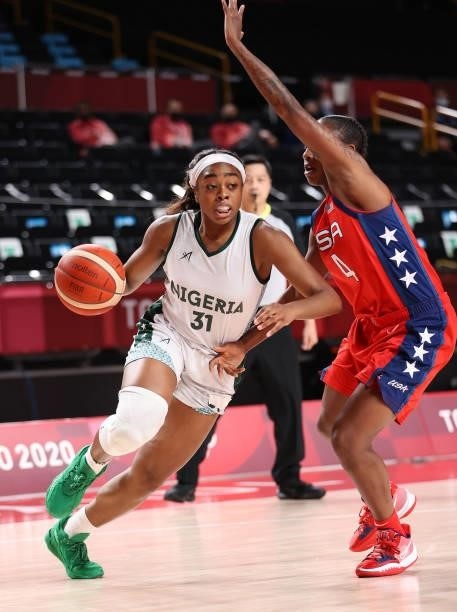 Erinma Ogwumike of Team Nigeria drives to the basket against Jewell Loyd of Team United States during a Women's Preliminary Round Group B game on day...