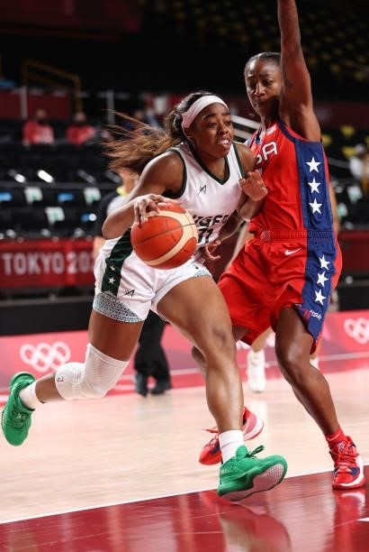 Erinma Ogwumike of Team Nigeria drives to the basket against Jewell Loyd of Team United States during a Women's Preliminary Round Group B game on day...