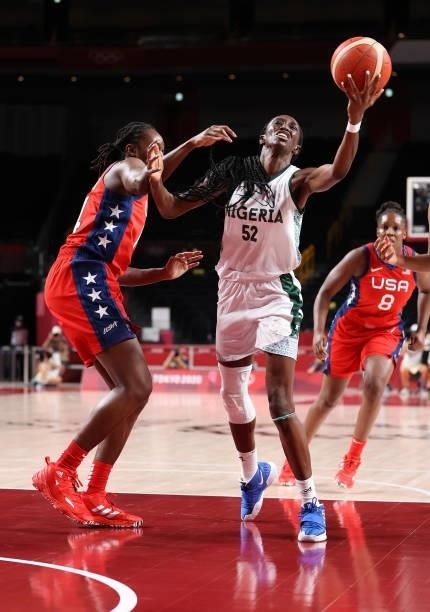 Ify Ibekwe of Team Nigeria goes up for a shot against Tina Charles of Team United States during a Women's Preliminary Round Group B game on day four...