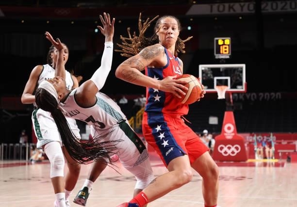 Brittney Griner of Team United States knocks down Ezinne Kalu of Team Nigeria during the second half of a Women's Preliminary Round Group B game on...